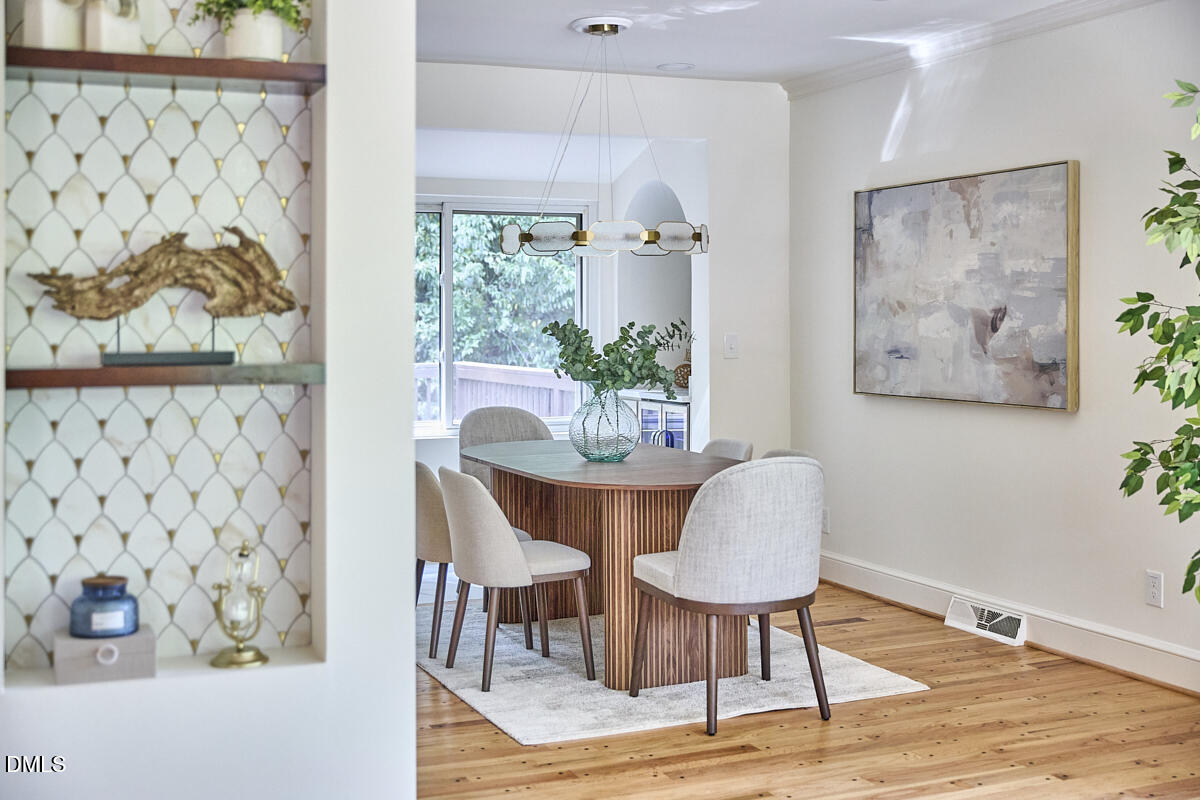 1609 Acadia Street Durham, NC 27701 - Photo 10 of 56 a dining room with furniture and wooden floor