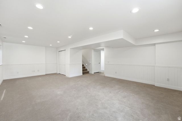 3027 Homestead Road Park City, UT 84098 - Photo 44 of 62 Expansive carpeted room featuring white beadboard wainscoting, recessed lighting, and a neutral color palette