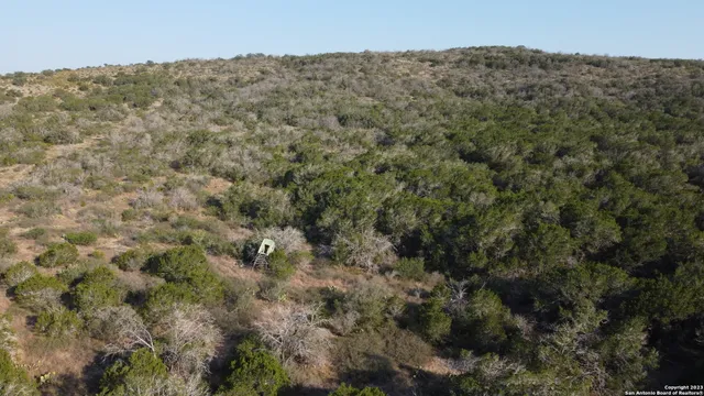 a view of a dry yard with and mountain view