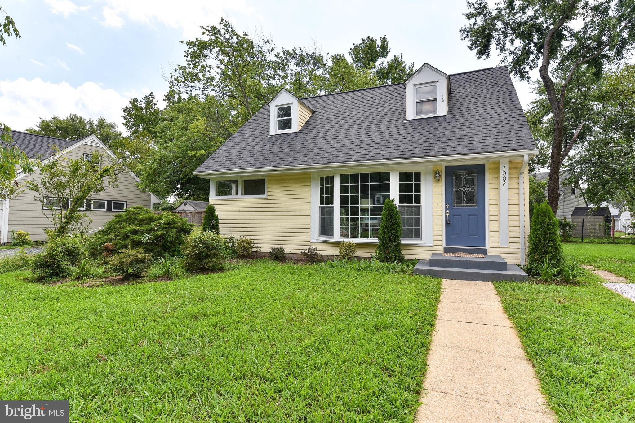 a front view of a house with yard