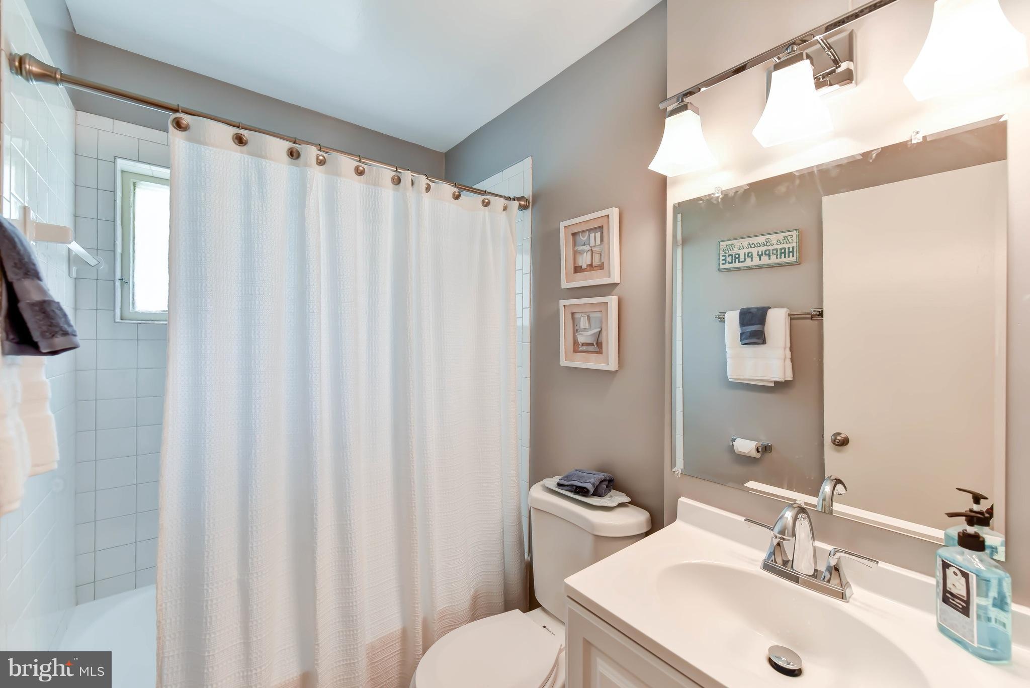 7002 Quander Road Alexandria, VA 22307 - Photo 13 of 23 a bathroom with a sink and a mirror