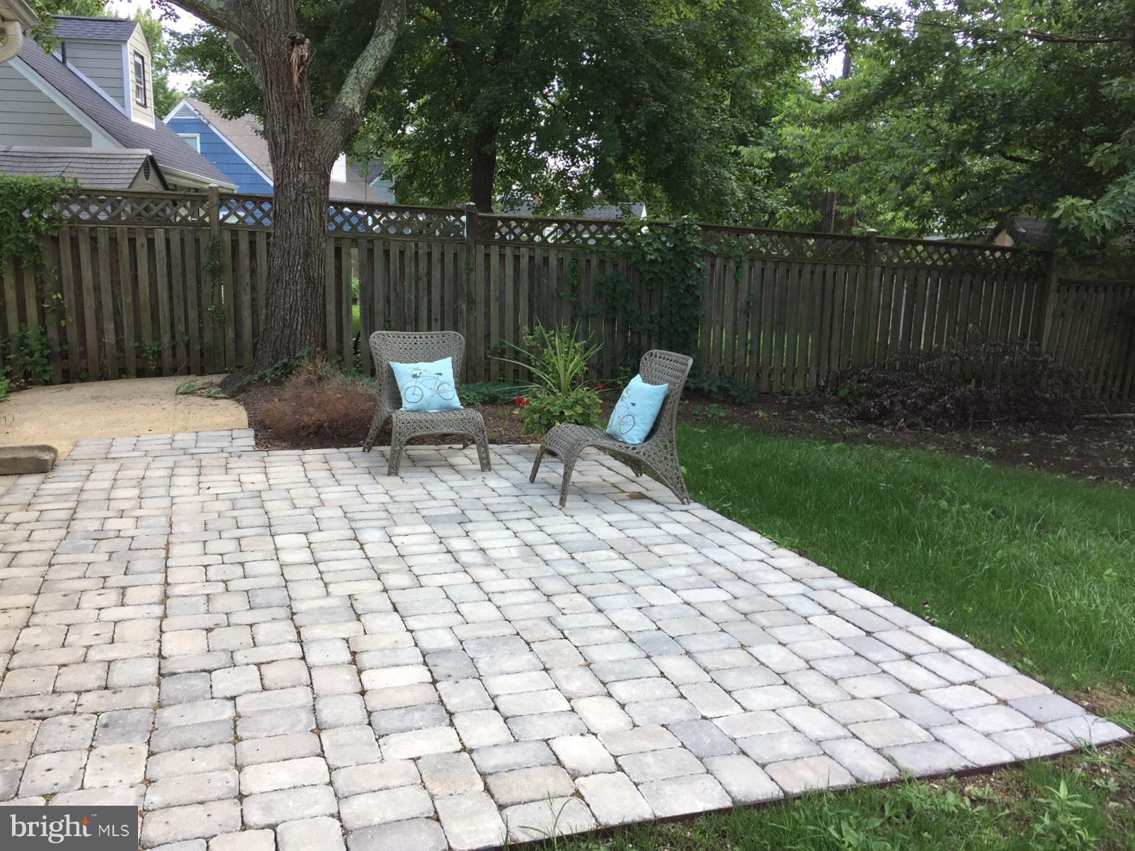 7002 Quander Road Alexandria, VA 22307 - Photo 22 of 23 a view of a chair and table in backyard of house