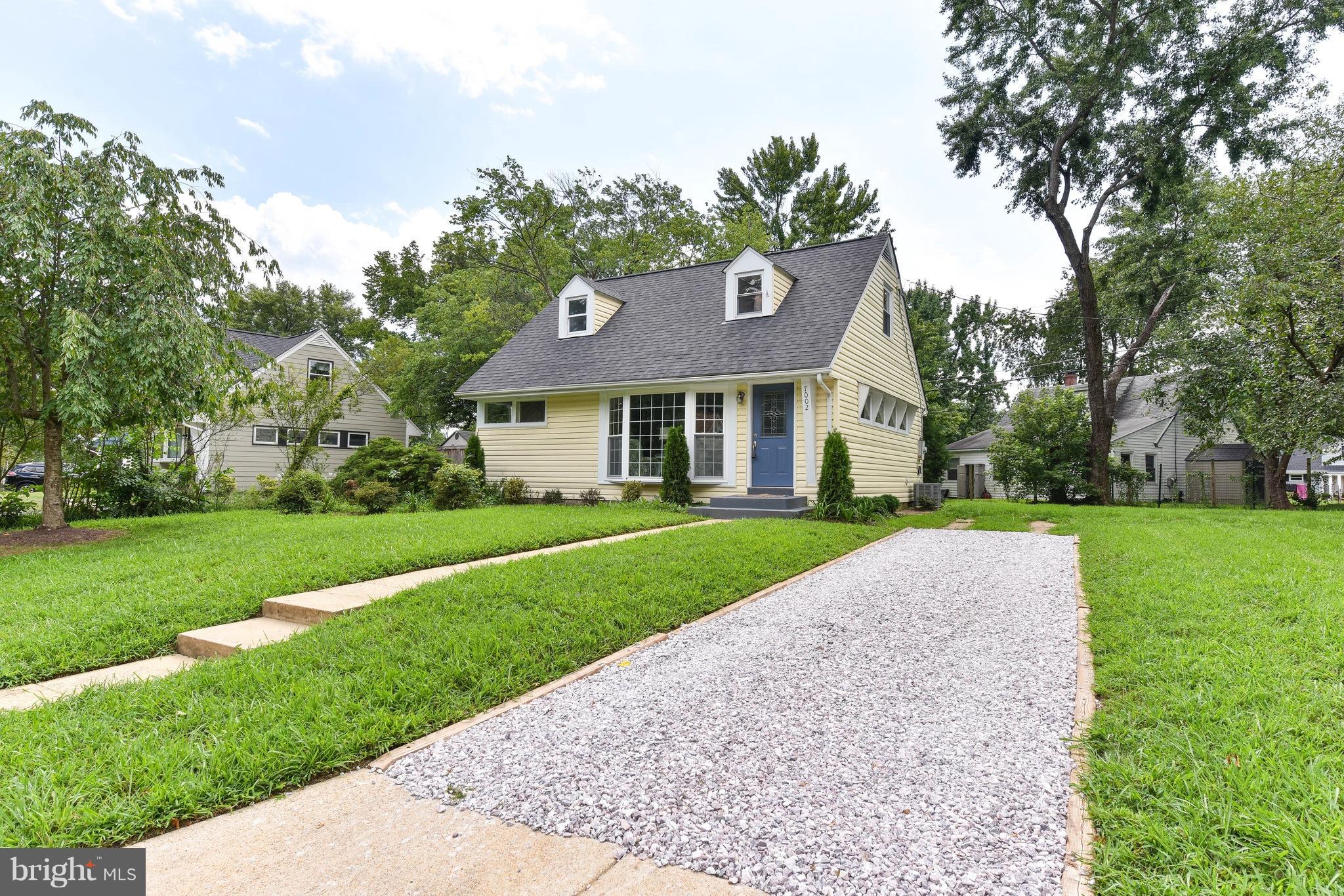 7002 Quander Road Alexandria, VA 22307 - Photo 23 of 23 a front view of house with yard and green space