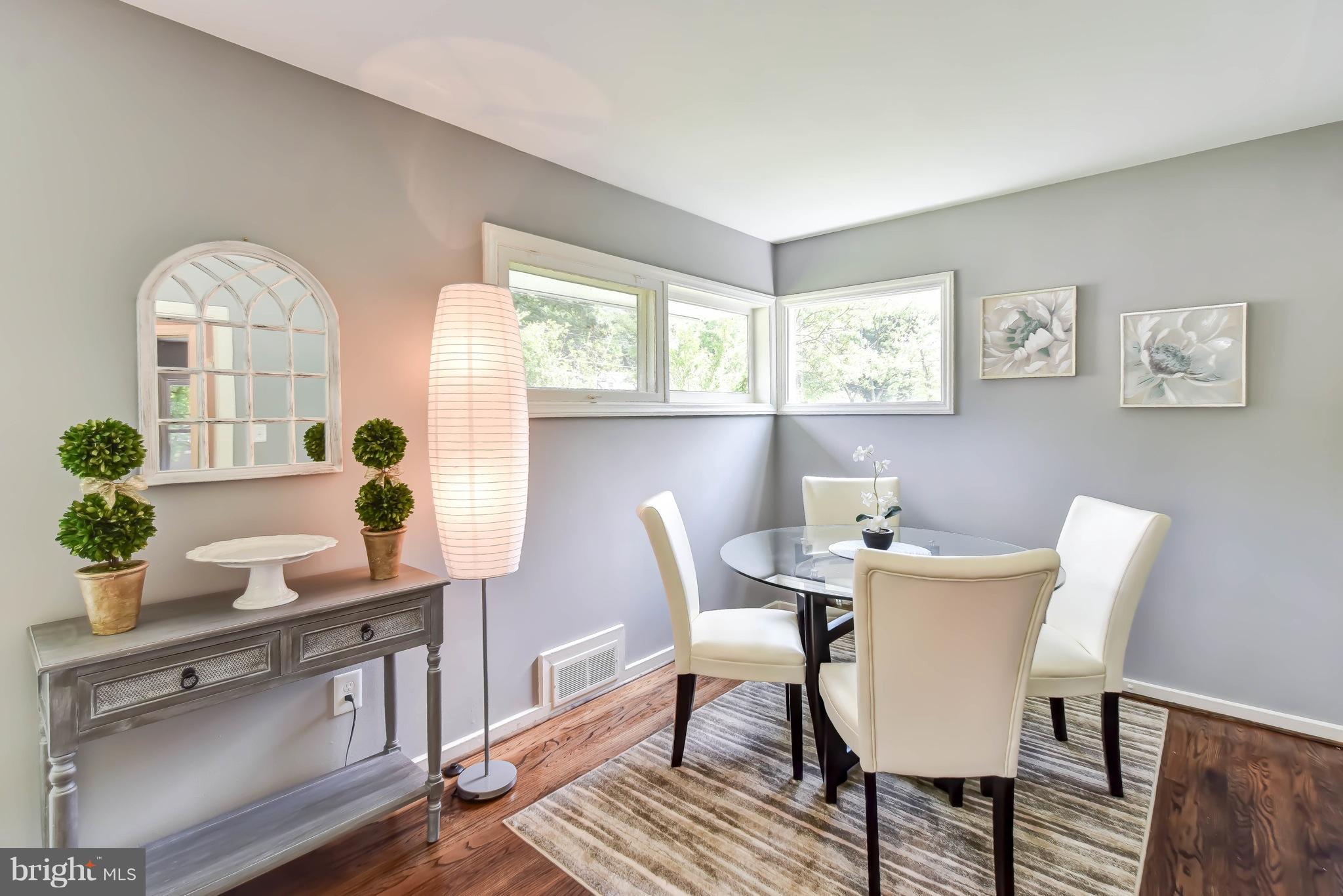 7002 Quander Road Alexandria, VA 22307 - Photo 7 of 23 a view of a dining room with furniture and a potted plant