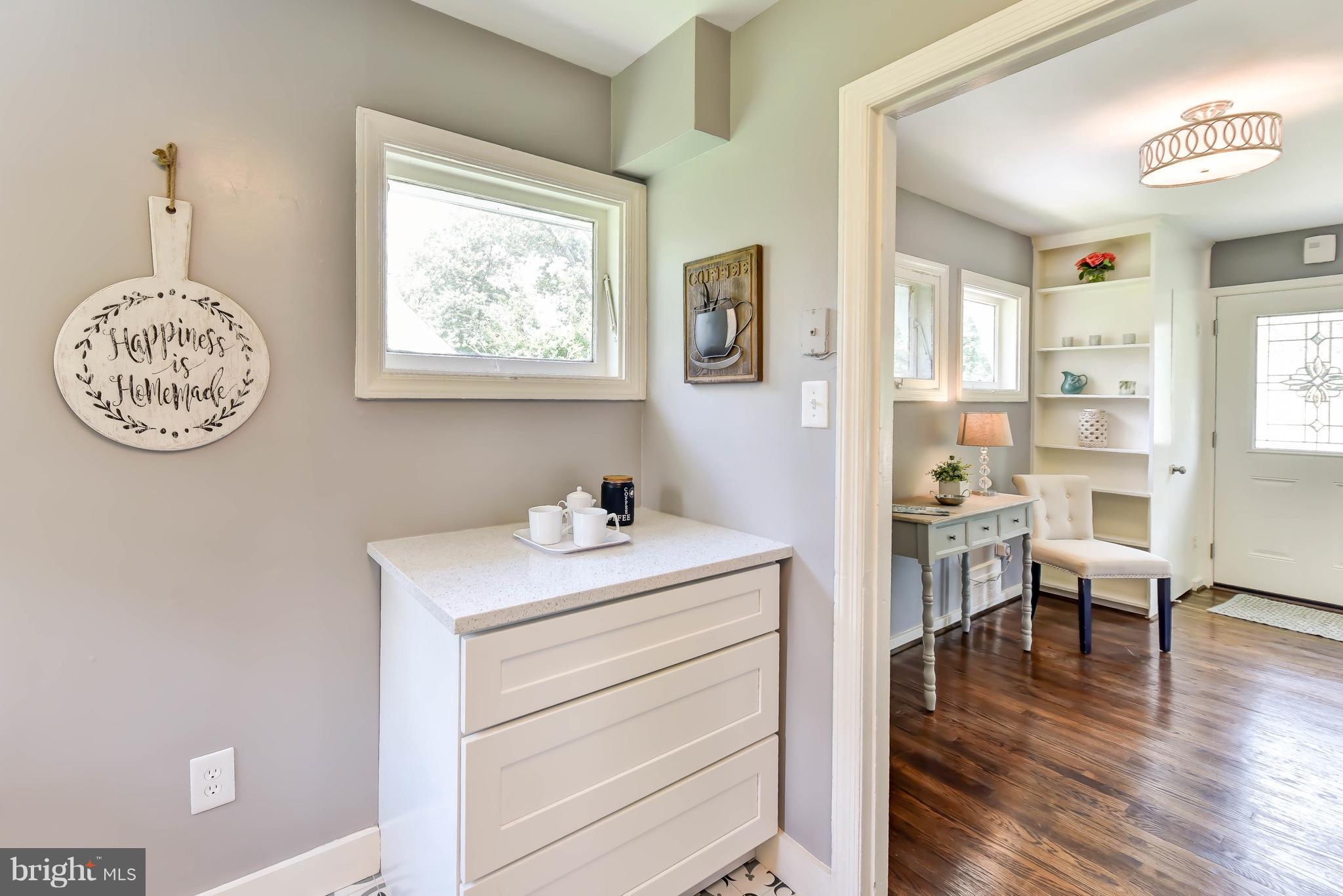7002 Quander Road Alexandria, VA 22307 - Photo 10 of 23 a view of a workspace with furniture and a window