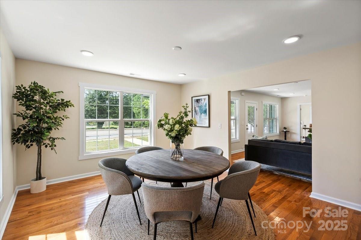 6034 Tuckaseegee Road Charlotte, NC 28208 - Photo 13 of 35 a view of a dining room with furniture and a potted plant