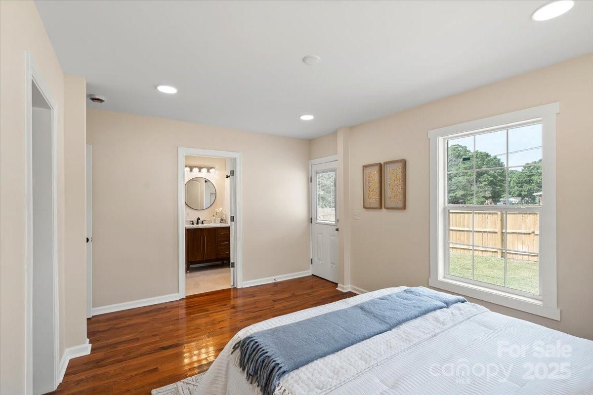 6034 Tuckaseegee Road Charlotte, NC 28208 - Photo 19 of 35 a bedroom with a bed and a window