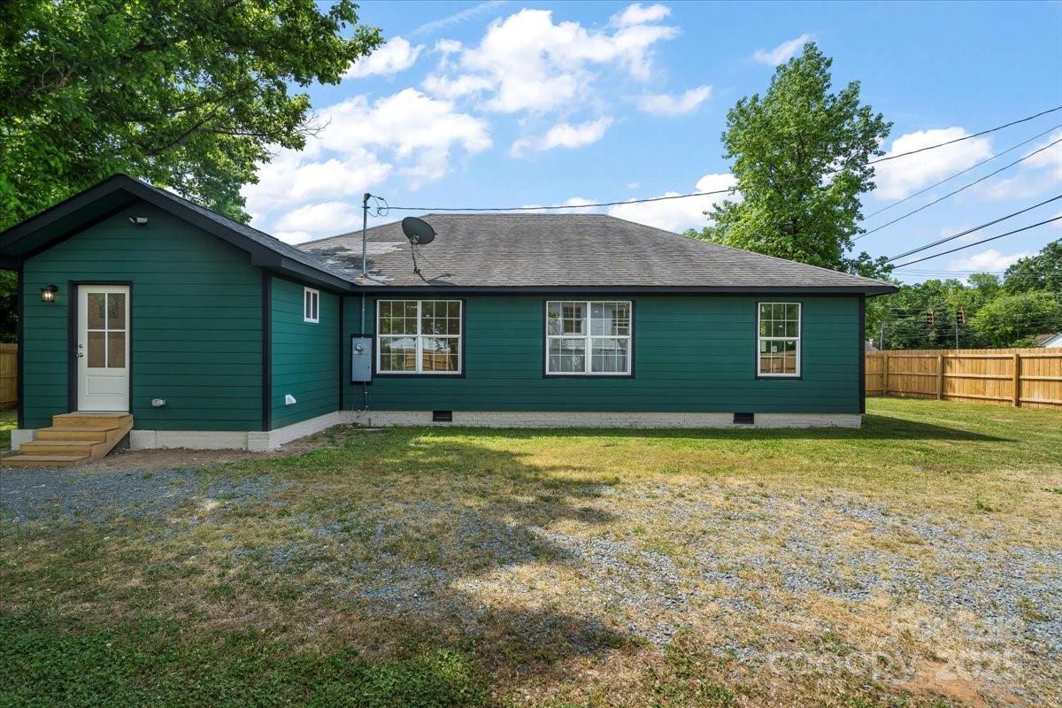 6034 Tuckaseegee Road Charlotte, NC 28208 - Photo 30 of 35 a view of a house with a yard