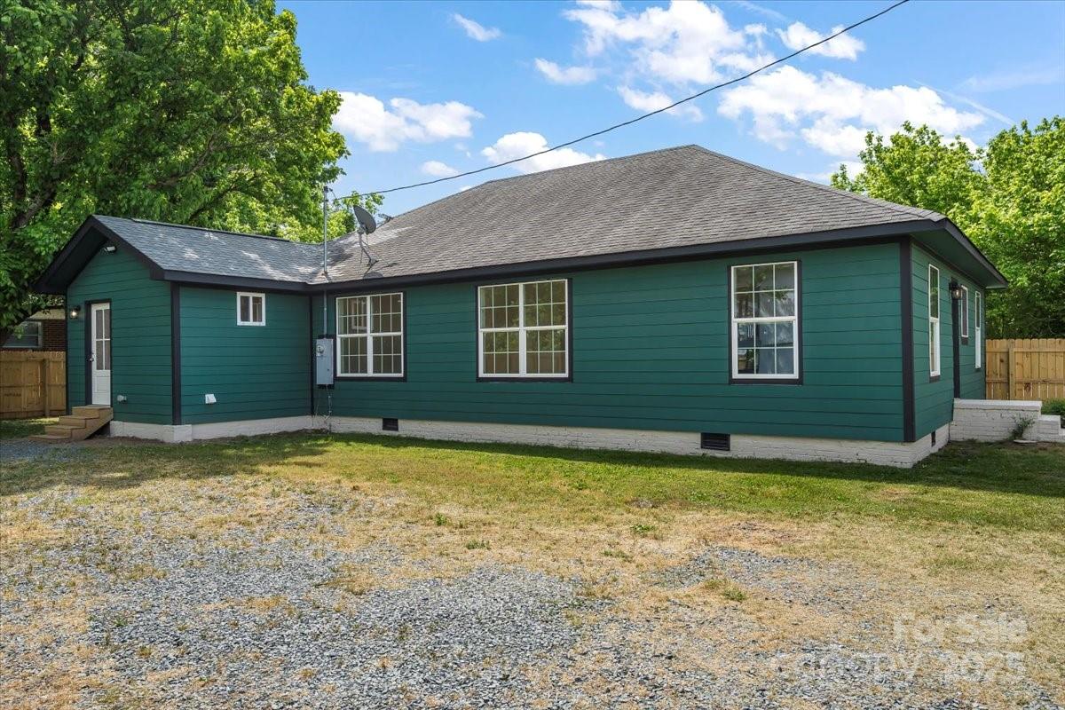 6034 Tuckaseegee Road Charlotte, NC 28208 - Photo 31 of 35 a view of a house with a yard