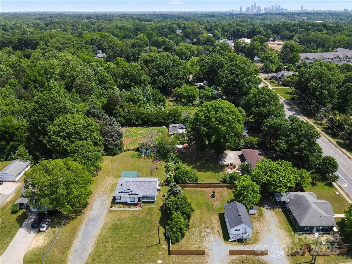 6034 Tuckaseegee Road Charlotte, NC 28208 - Photo 33 of 35 an aerial view of a house with yard