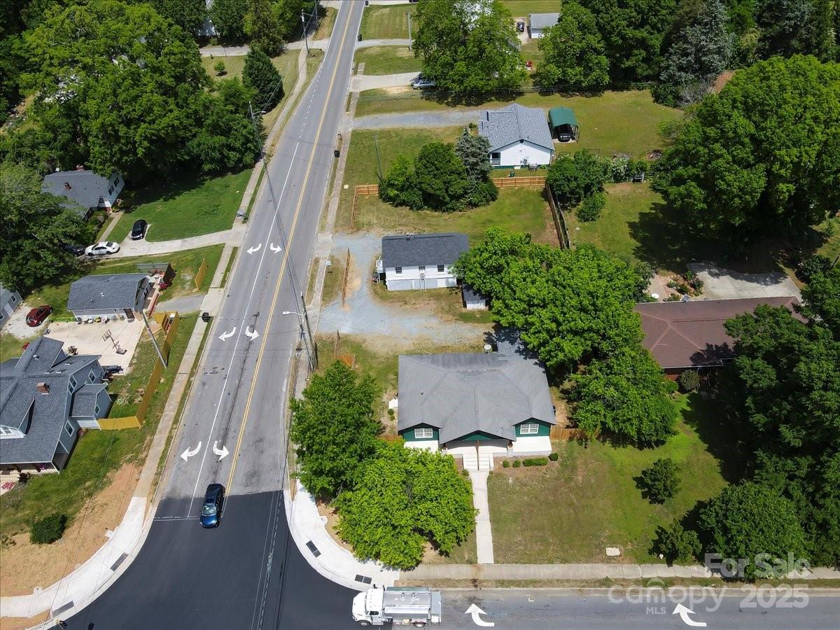 6034 Tuckaseegee Road Charlotte, NC 28208 - Photo 35 of 35 an aerial view of residential houses with outdoor space