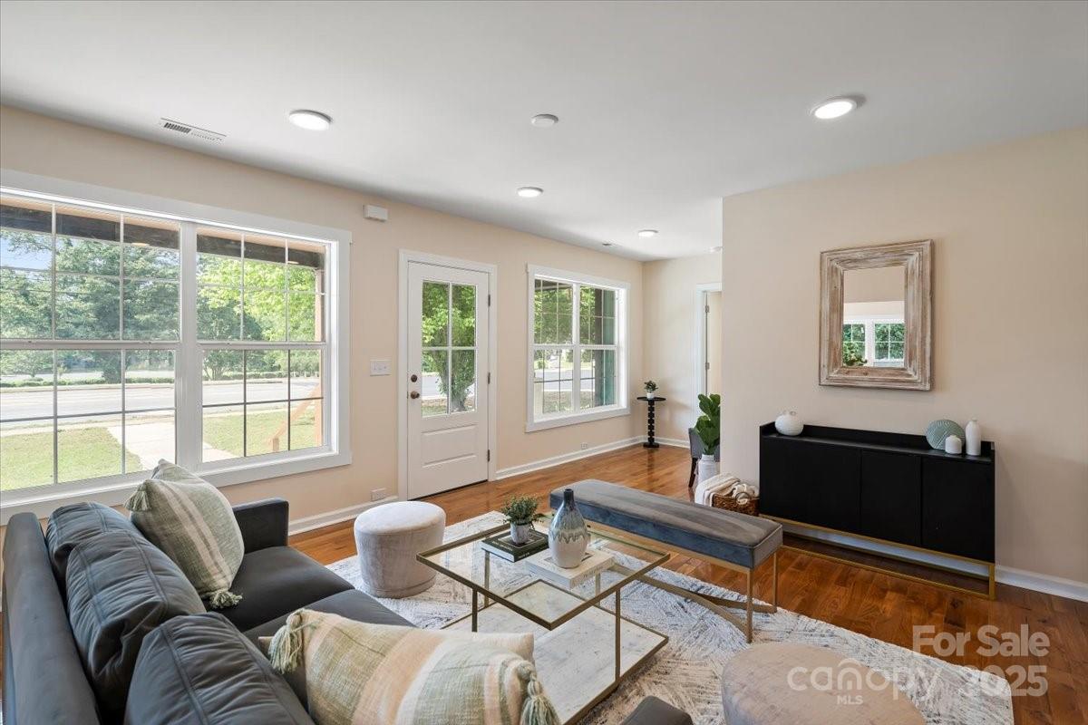 6034 Tuckaseegee Road Charlotte, NC 28208 - Photo 4 of 35 a living room with furniture and a flat screen tv