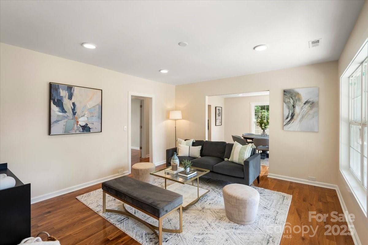 6034 Tuckaseegee Road Charlotte, NC 28208 - Photo 6 of 35 a living room with furniture and wooden floor