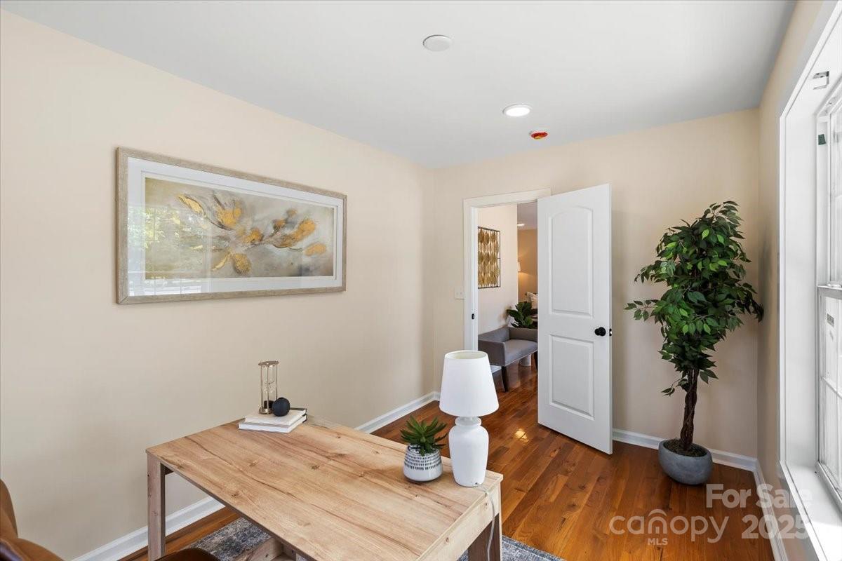 6034 Tuckaseegee Road Charlotte, NC 28208 - Photo 10 of 35 a living room with furniture and potted plant