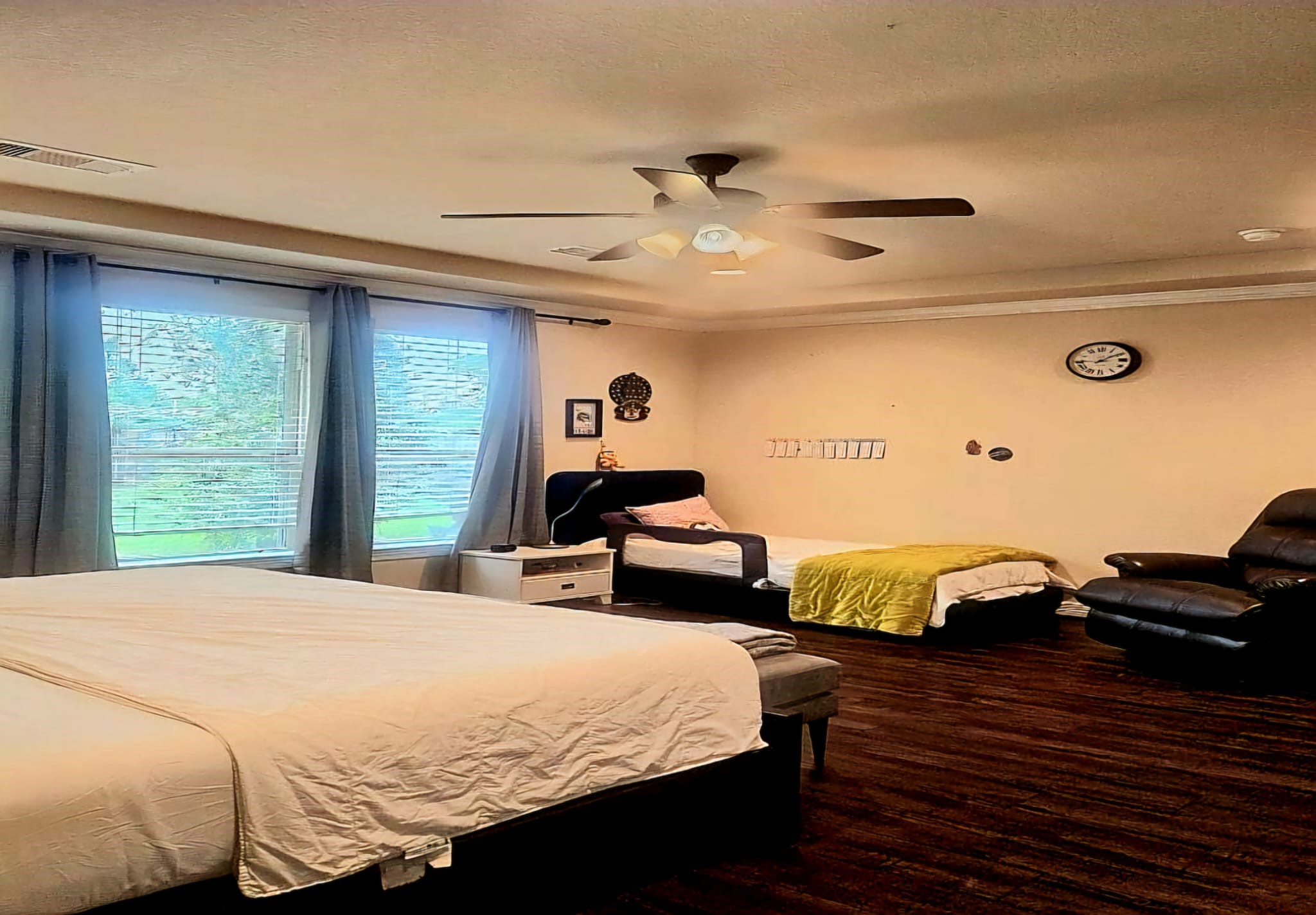 5206 Jacob Ridge Court Sugar Land, TX 77479 - Photo 11 of 42 a bedroom with a bed and wooden floor