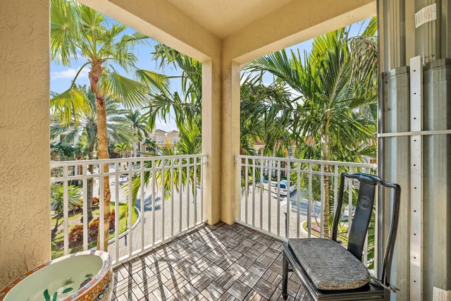 a view of a balcony with furniture