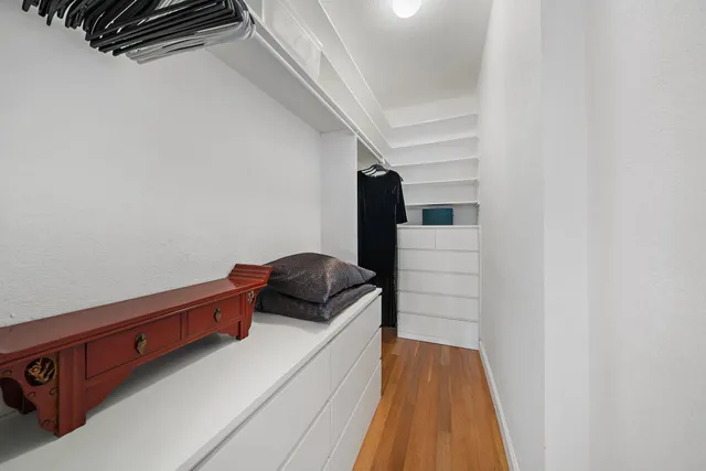 a hallway with a bed