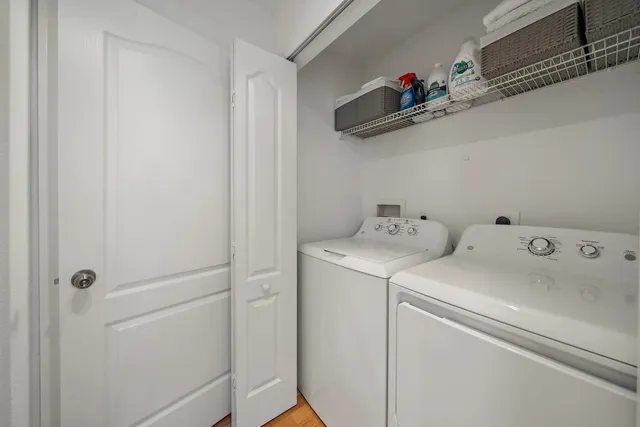 a view of storage and utility room with washer and dryer