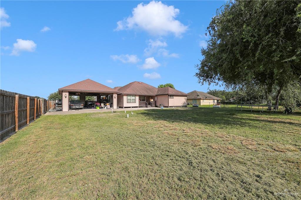 12813 North 106th Street Mission, TX 78573 - Photo 16 of 17 Back of house featuring a fenced backyard
