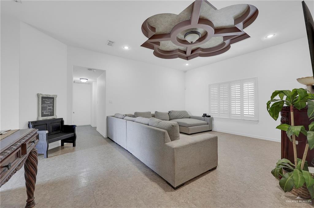 12813 North 106th Street Mission, TX 78573 - Photo 3 of 17 Living room featuring recessed lighting and light flooring