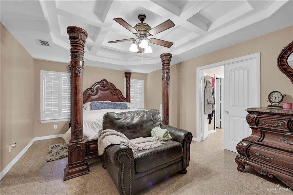 12813 North 106th Street Mission, TX 78573 - Photo 9 of 17 Bedroom with coffered ceiling, ceiling fan, and beam ceiling