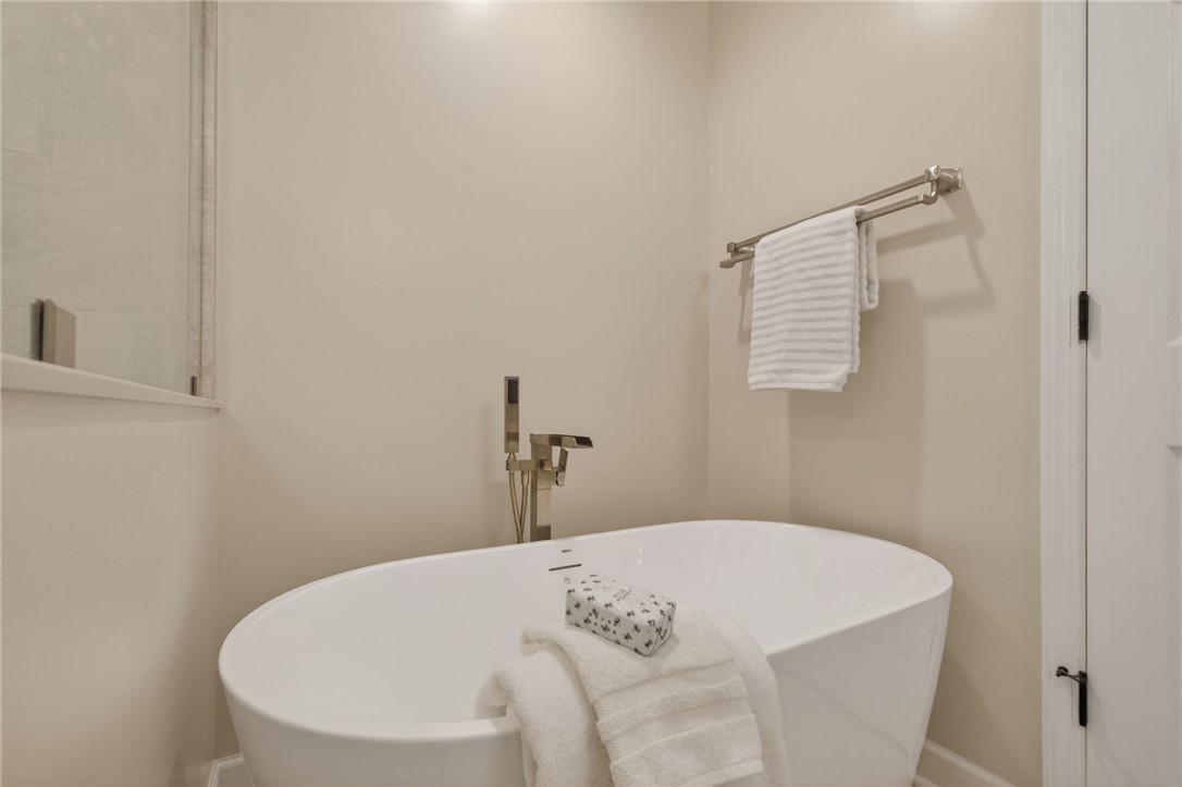 322 Shorecrest Drive Seneca, SC 29672 - Photo 16 of 30 This serene bathing space features a freestanding tub, offering a peaceful retreat.