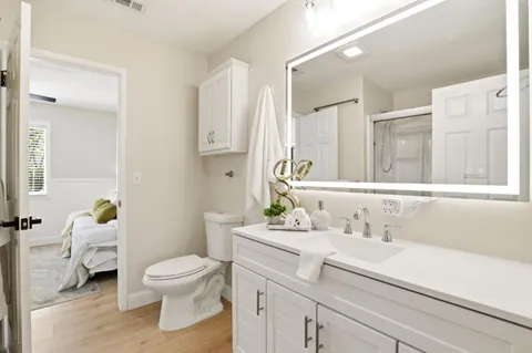 a bathroom with a sink toilet and shower