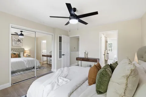 a bedroom with a bed and window