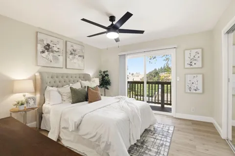 a bedroom with a large bed and a window