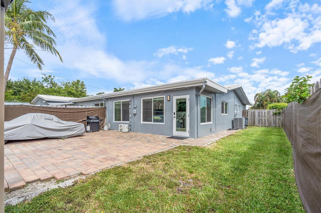 2242 Northeast 37th Street Lighthouse Point, FL 33064 - Photo 11 of 22 a view of a house with backyard and sitting area