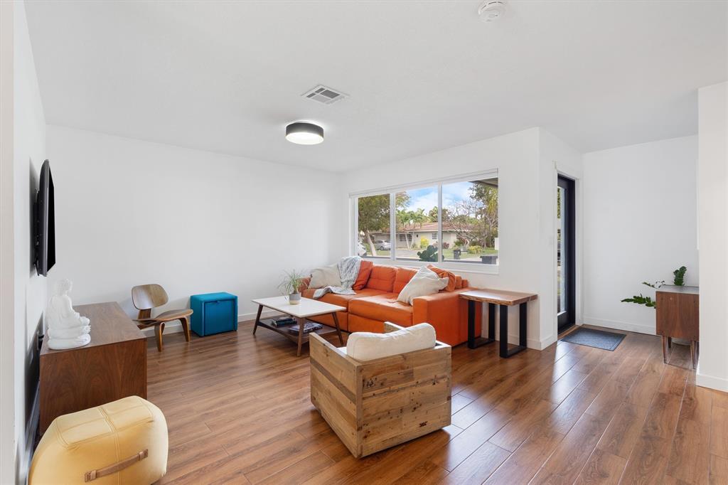 2242 Northeast 37th Street Lighthouse Point, FL 33064 - Photo 14 of 22 a living room with furniture and wooden floor