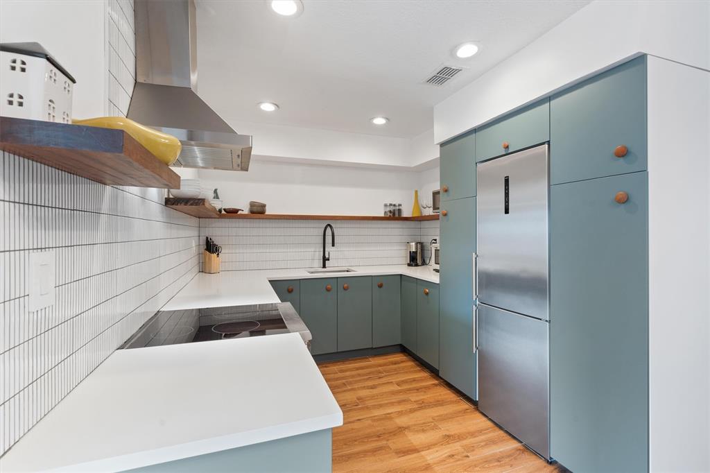 2242 Northeast 37th Street Lighthouse Point, FL 33064 - Photo 15 of 22 a kitchen with refrigerator and cabinets