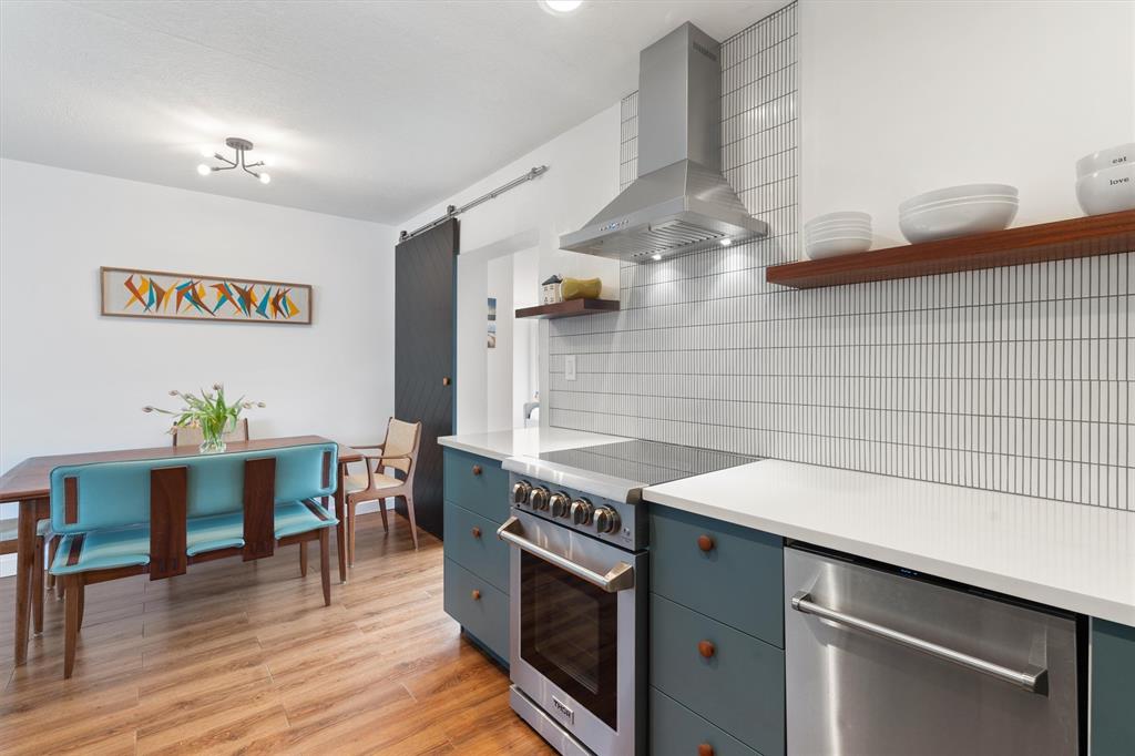 2242 Northeast 37th Street Lighthouse Point, FL 33064 - Photo 16 of 22 a kitchen with a stove and cabinets