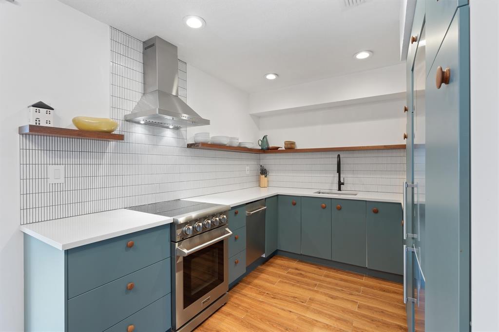 2242 Northeast 37th Street Lighthouse Point, FL 33064 - Photo 4 of 22 a kitchen with stainless steel appliances granite countertop a sink and a stove