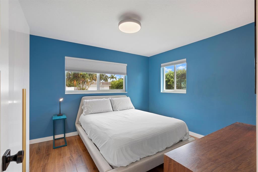 2242 Northeast 37th Street Lighthouse Point, FL 33064 - Photo 6 of 22 a bedroom with a bed and a window