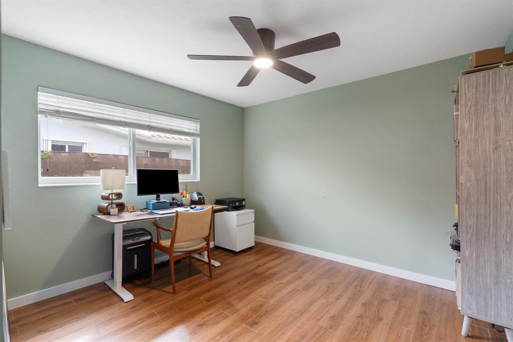 2242 Northeast 37th Street Lighthouse Point, FL 33064 - Photo 8 of 22 a view of a workspace with furniture and a window