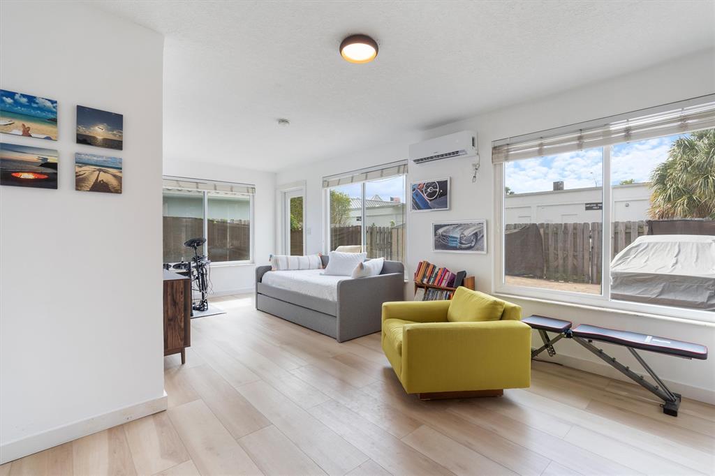 2242 Northeast 37th Street Lighthouse Point, FL 33064 - Photo 10 of 22 a living room with furniture and a large window