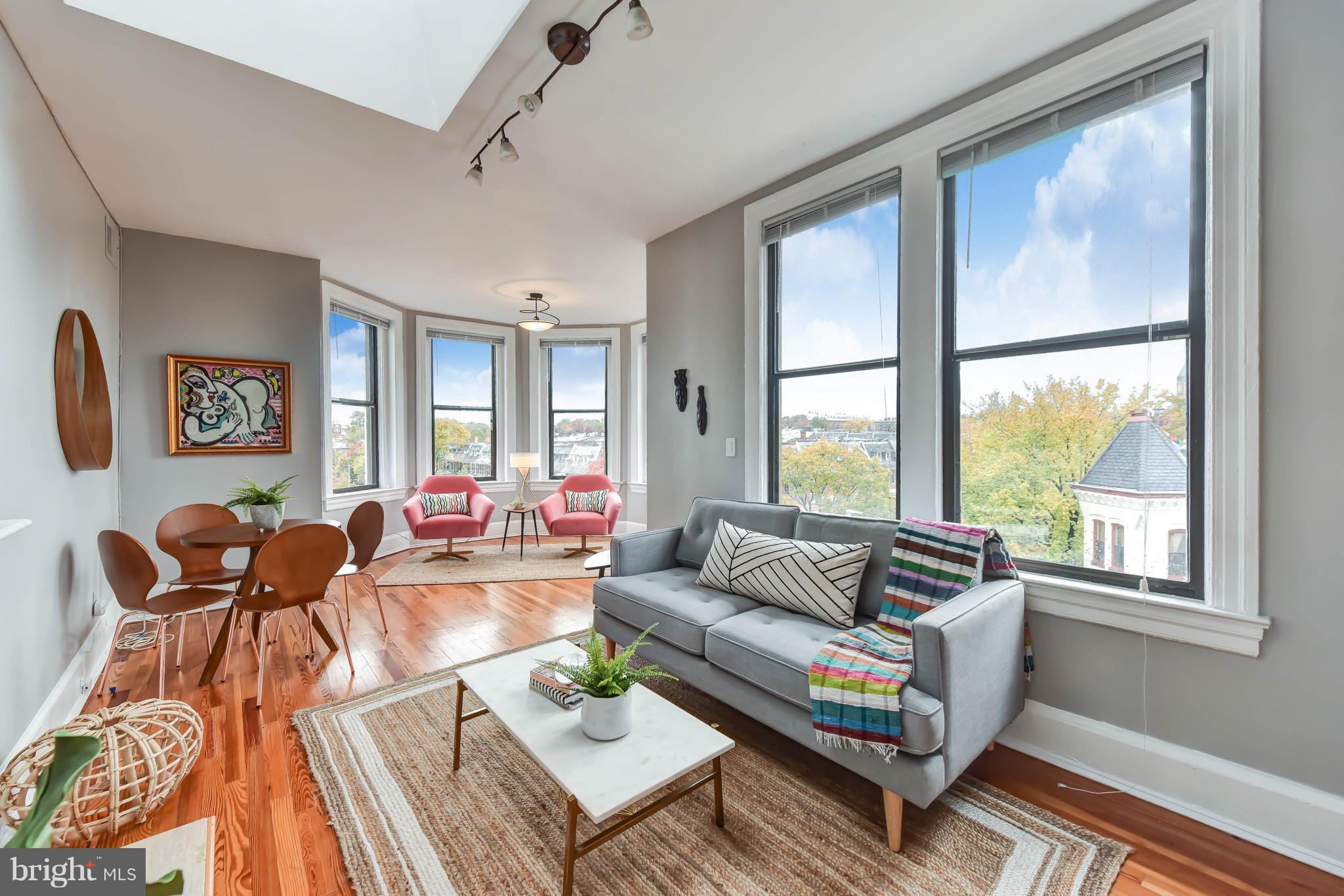 520 E Street Northeast, Unit 401 Washington, DC 20002 - Photo 1 of 23 a living room with furniture and a large window