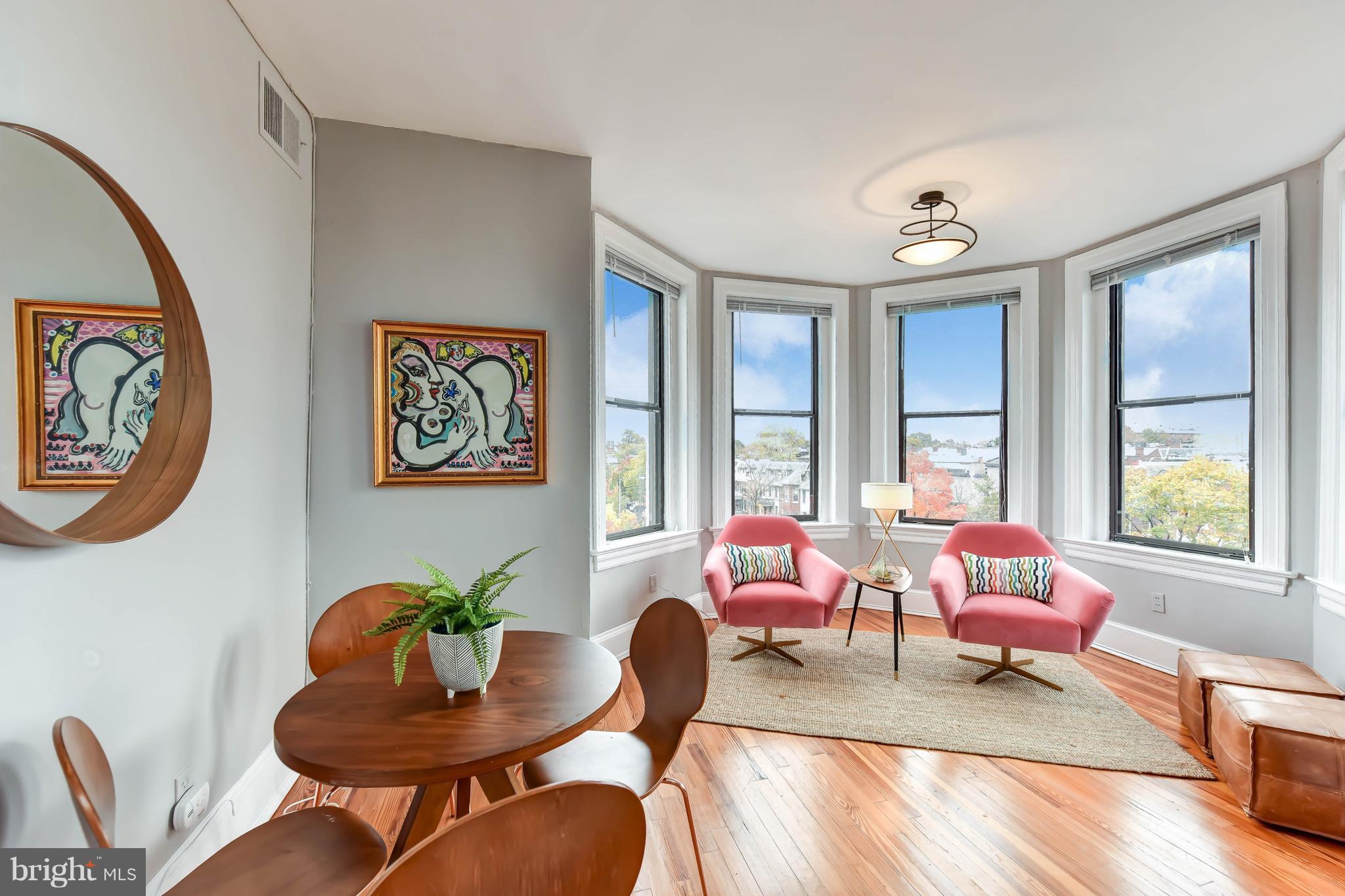 520 E Street Northeast, Unit 401 Washington, DC 20002 - Photo 2 of 23 a living room with furniture and a large window