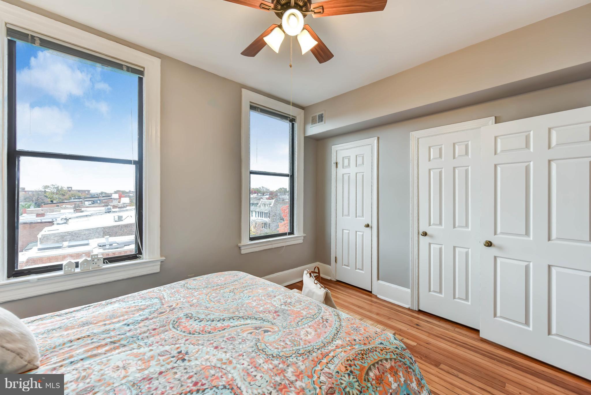 520 E Street Northeast, Unit 401 Washington, DC 20002 - Photo 12 of 23 a bedroom with a large bed and a window