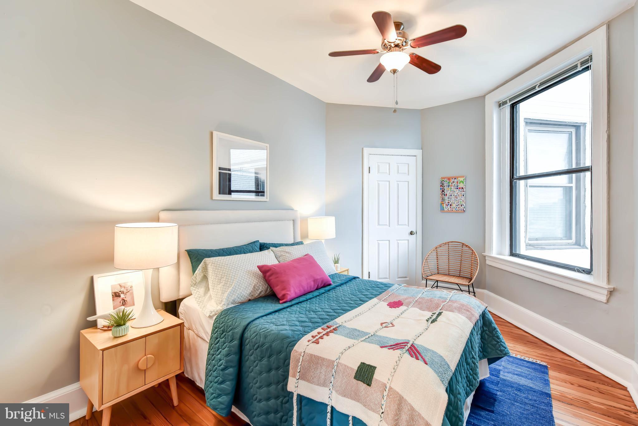 520 E Street Northeast, Unit 401 Washington, DC 20002 - Photo 15 of 23 a bedroom with two beds and a window
