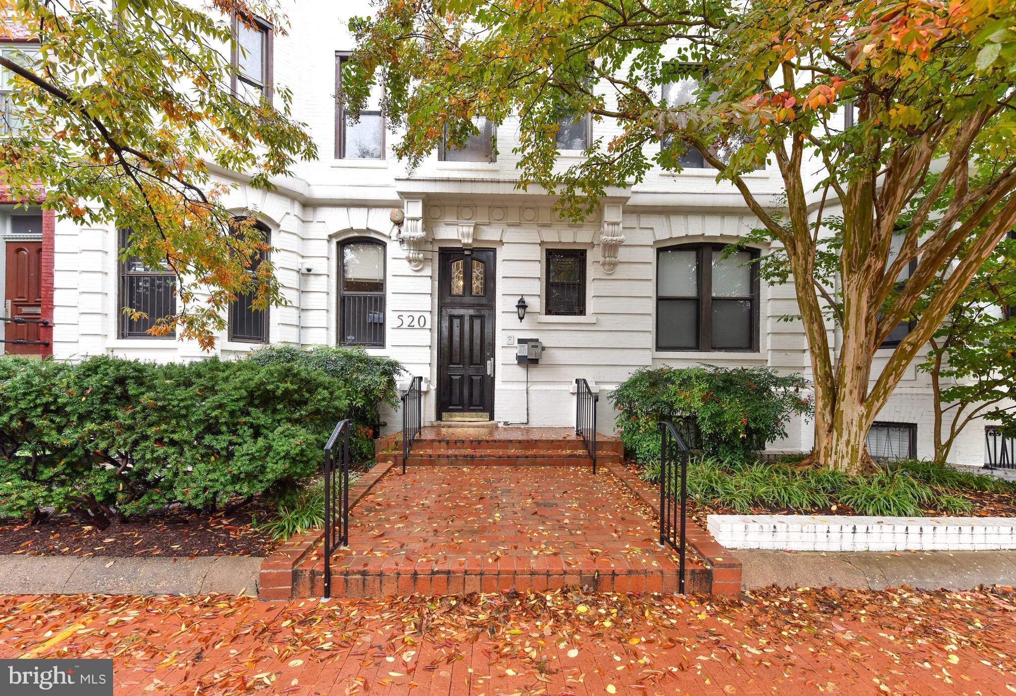 520 E Street Northeast, Unit 401 Washington, DC 20002 - Photo 19 of 23 a front view of a house with a garden