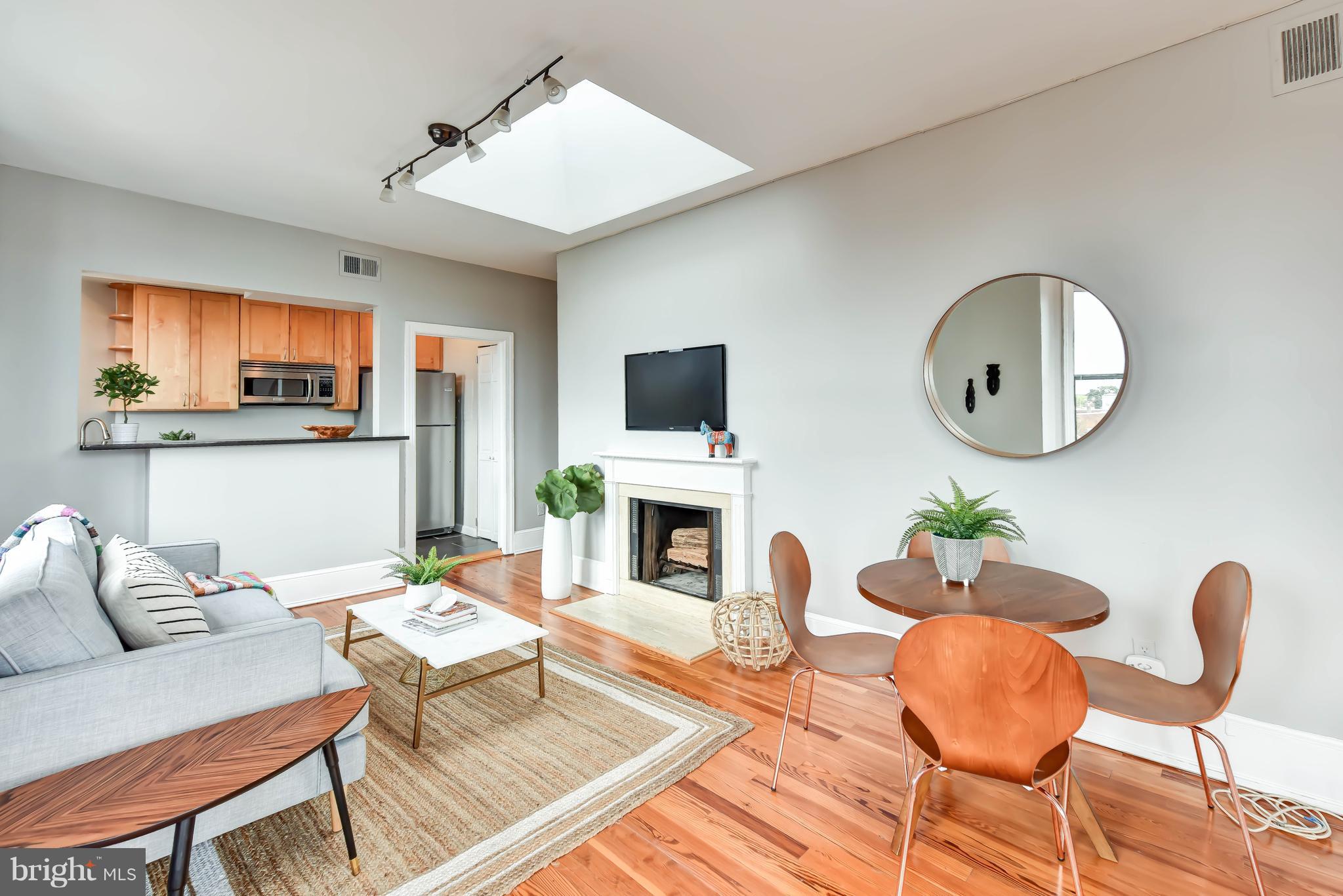 520 E Street Northeast, Unit 401 Washington, DC 20002 - Photo 4 of 23 a living room with furniture and a fireplace