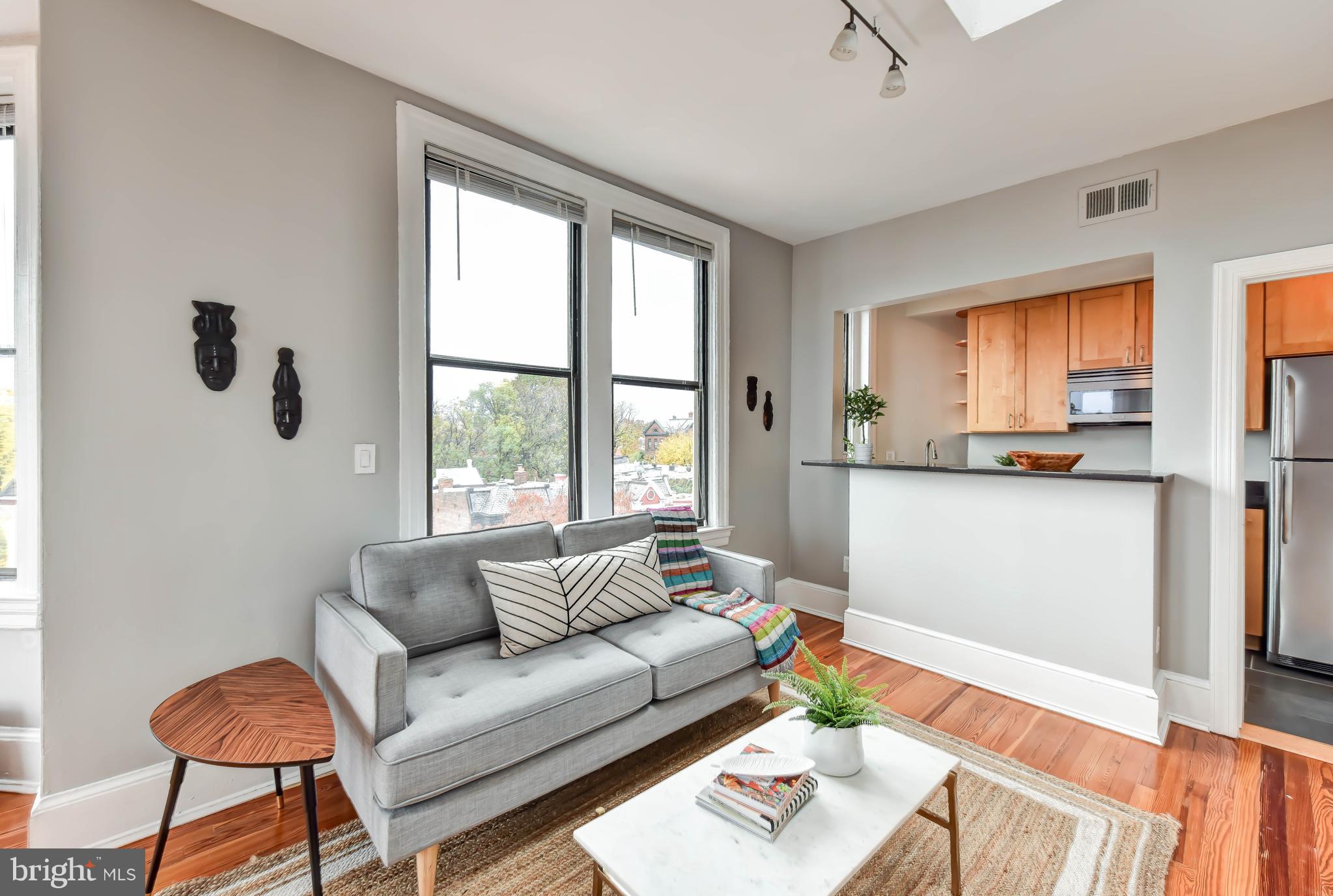 520 E Street Northeast, Unit 401 Washington, DC 20002 - Photo 5 of 23 a living room with furniture and a large window