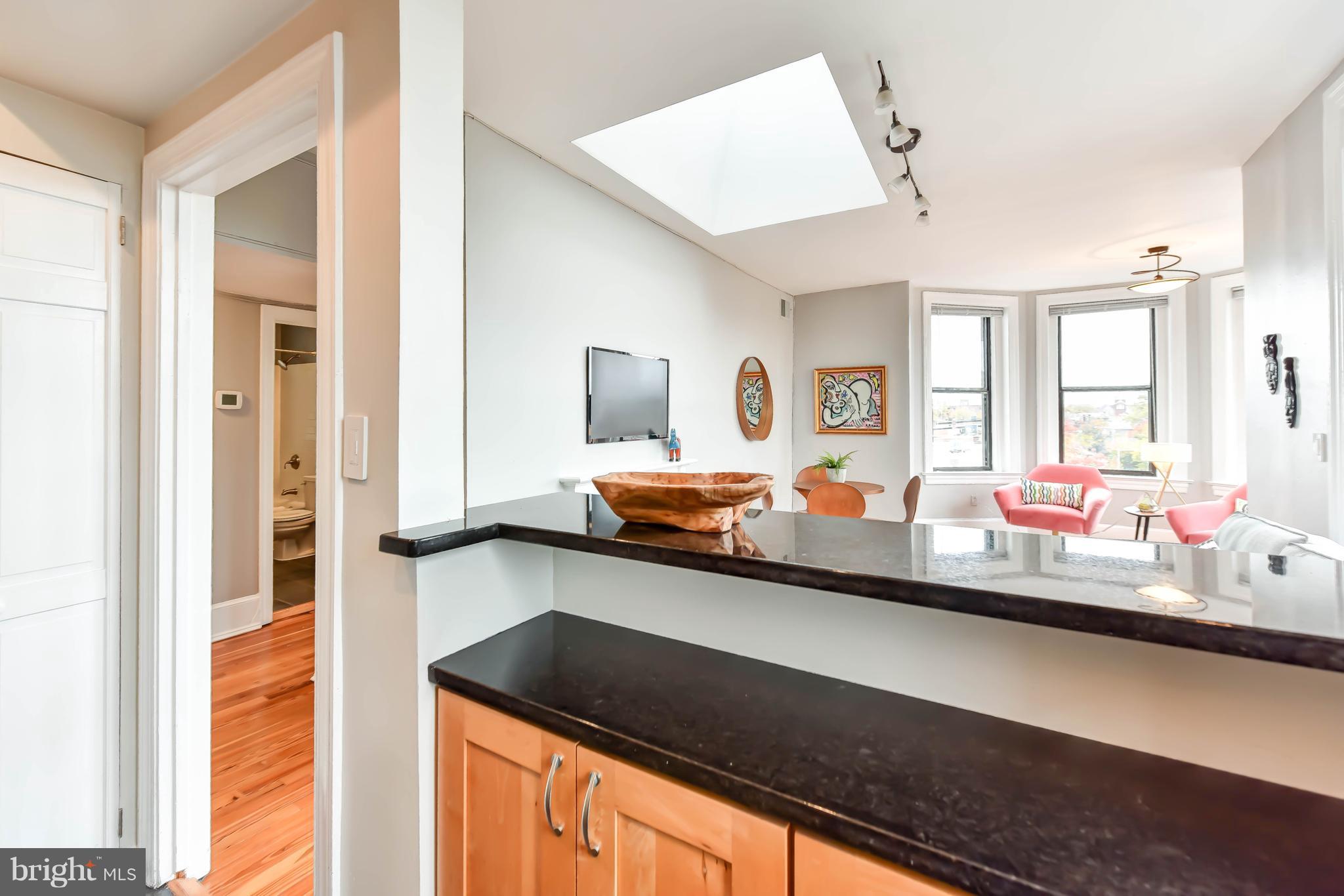520 E Street Northeast, Unit 401 Washington, DC 20002 - Photo 9 of 23 a view of a room with two sinks and a chandelier