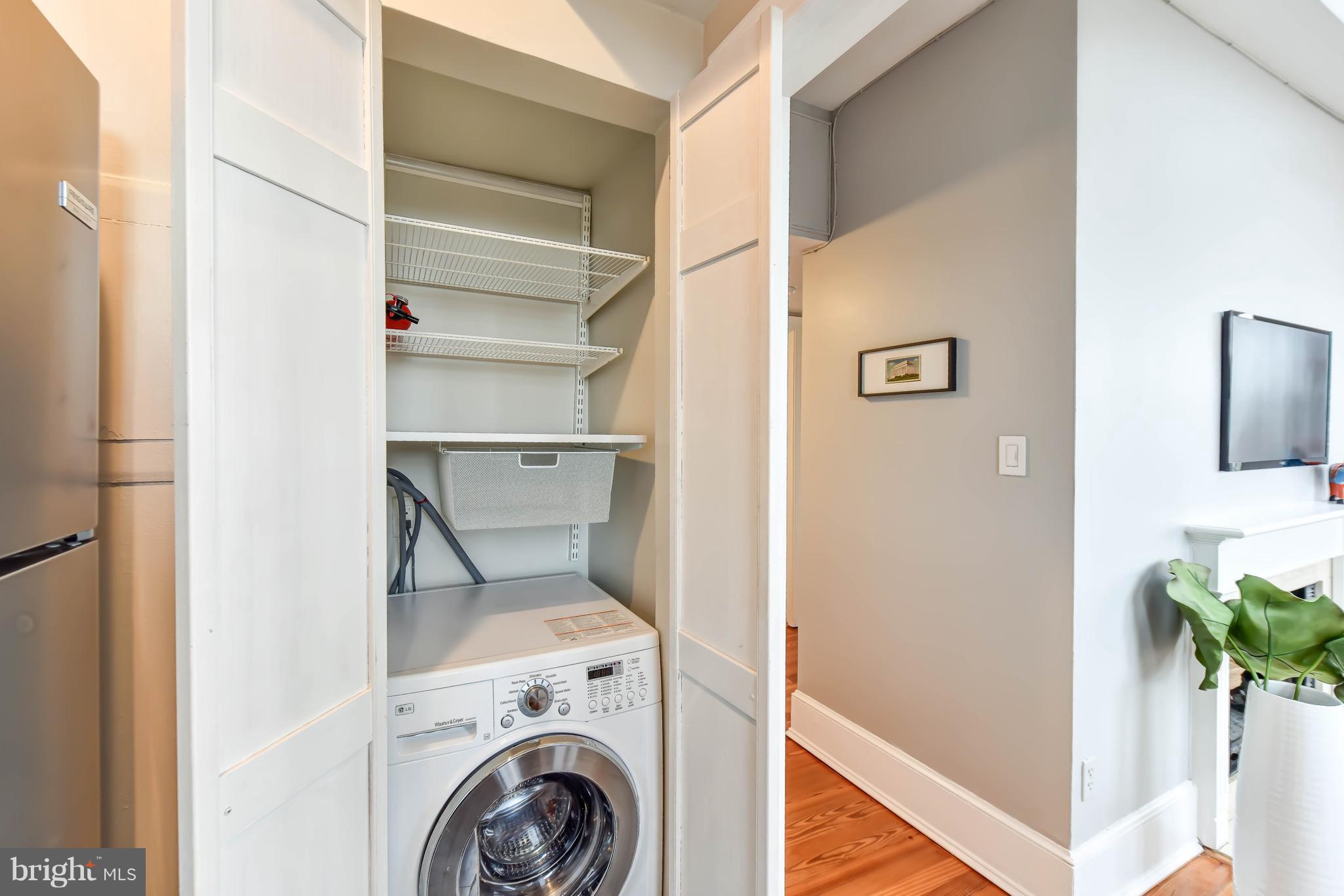 520 E Street Northeast, Unit 401 Washington, DC 20002 - Photo 10 of 23 a utility room with dryer and washer