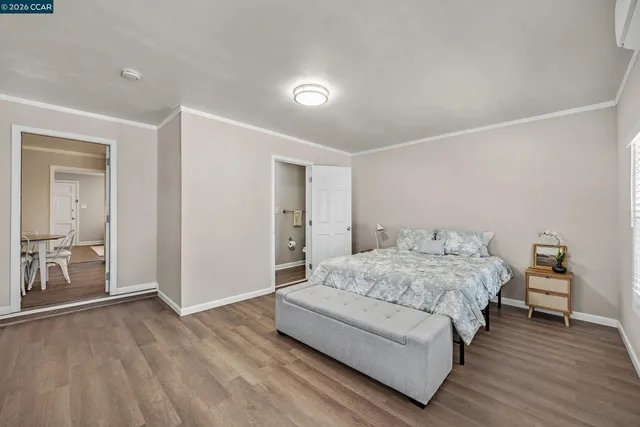 a bedroom with a bed and a table