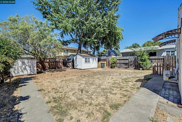 a view of a backyard with a sitting area