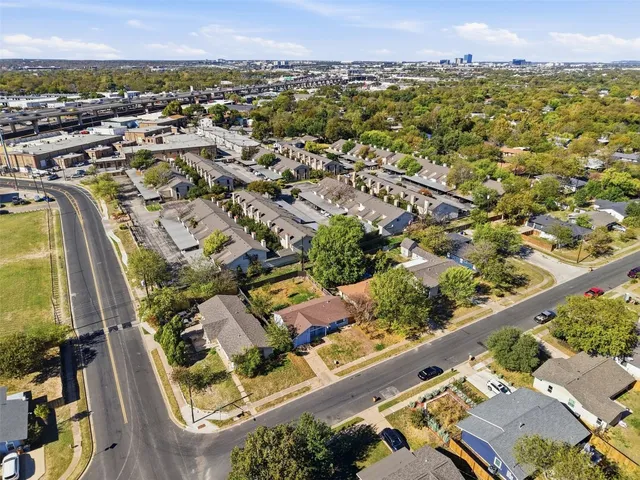 an aerial view of residential houses with outdoor space