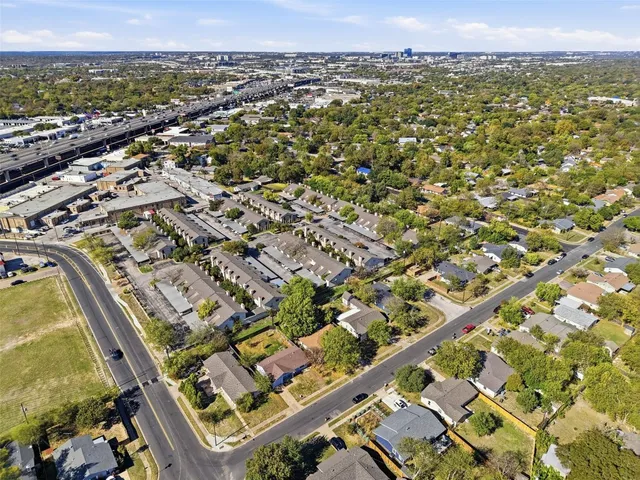 an aerial view of residential building and car parked
